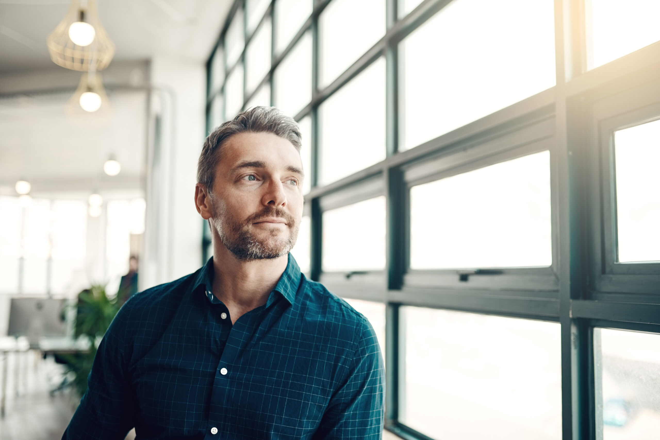 Man staring outsideof company